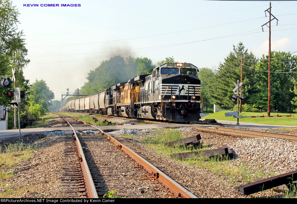 NS 9754 leads a southbound past 'Woods' 