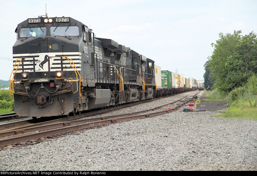 Westbound intermodal train 213 approaches from the east.