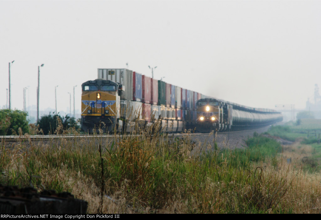 UP 8444 Stack Train passes by UP 5860 Tank Train