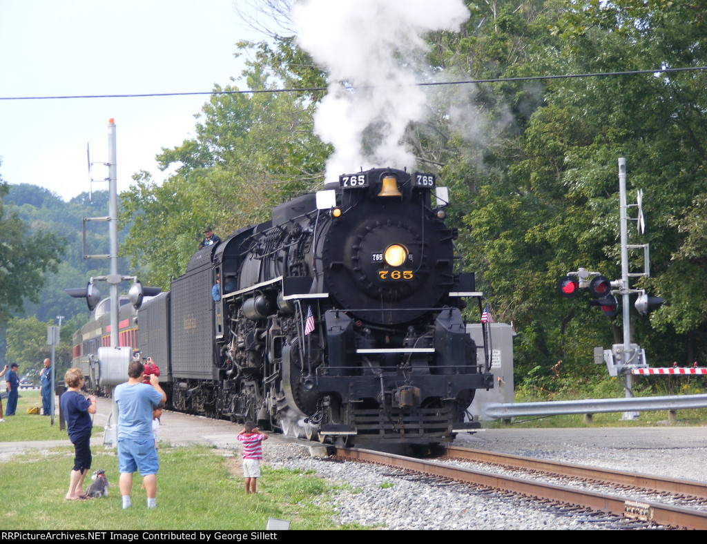 After its passengers reboard, NKP 765 departs for Akron Northside.