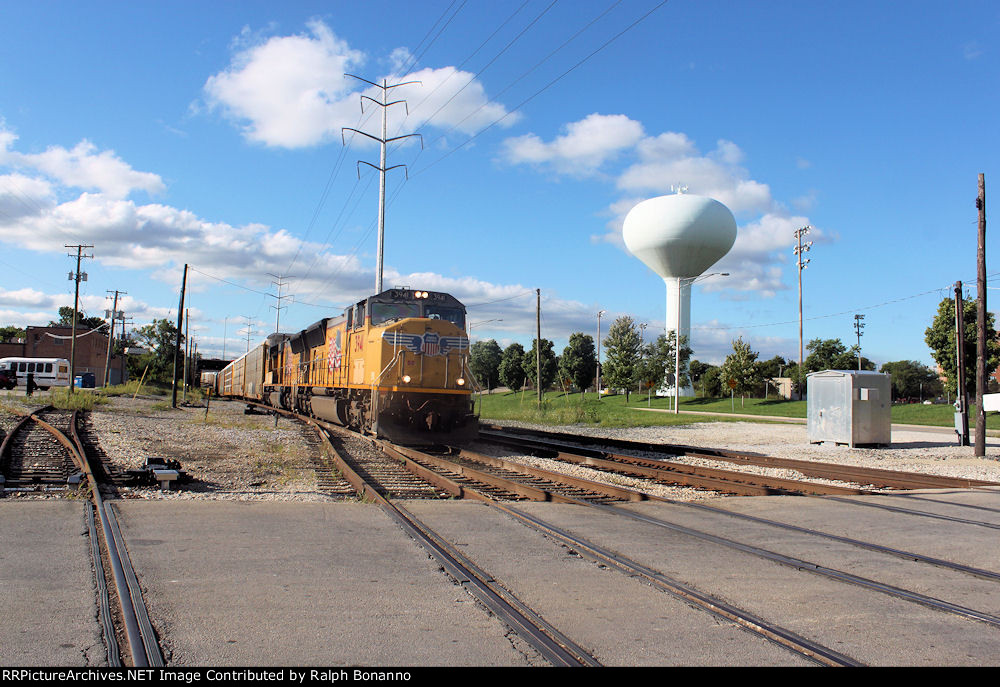 Northbound UP auto racks cross under the BNSF race track on the IHB
