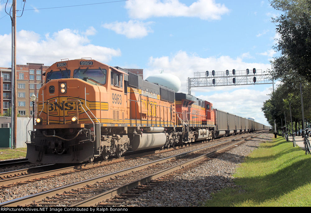 A westbound empty hopper train rolls into town in mid morning