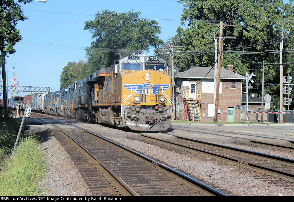An eastbound UP manifest, with CSX/HLCX power trailing, crosses the CN(EJ&E) main