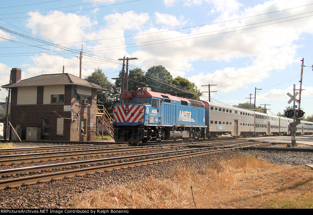 Metra F40PH # 155 shoves an eastbound off peak train past JB tower