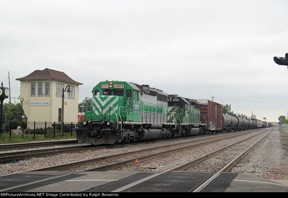 An eastbound CP freight with CITX power departs Bensenville Yard on an overcast Friday