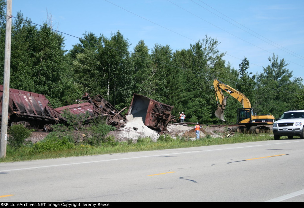 Track buckled behind tipped car