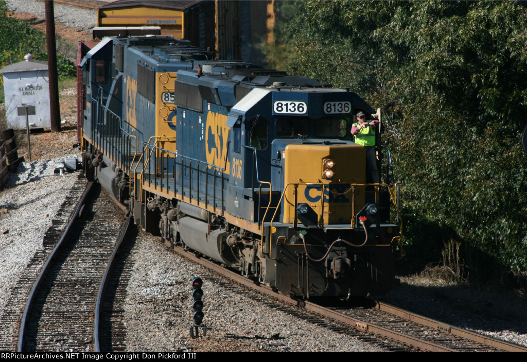 CSX 8136 arrived for a crew change, The conducter takes a look at his ...