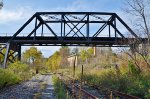 The P&S crosses the B&P, which passes yet another abandoned factory.
