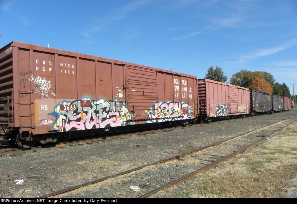 Line of stored cars in front of Sturgis station