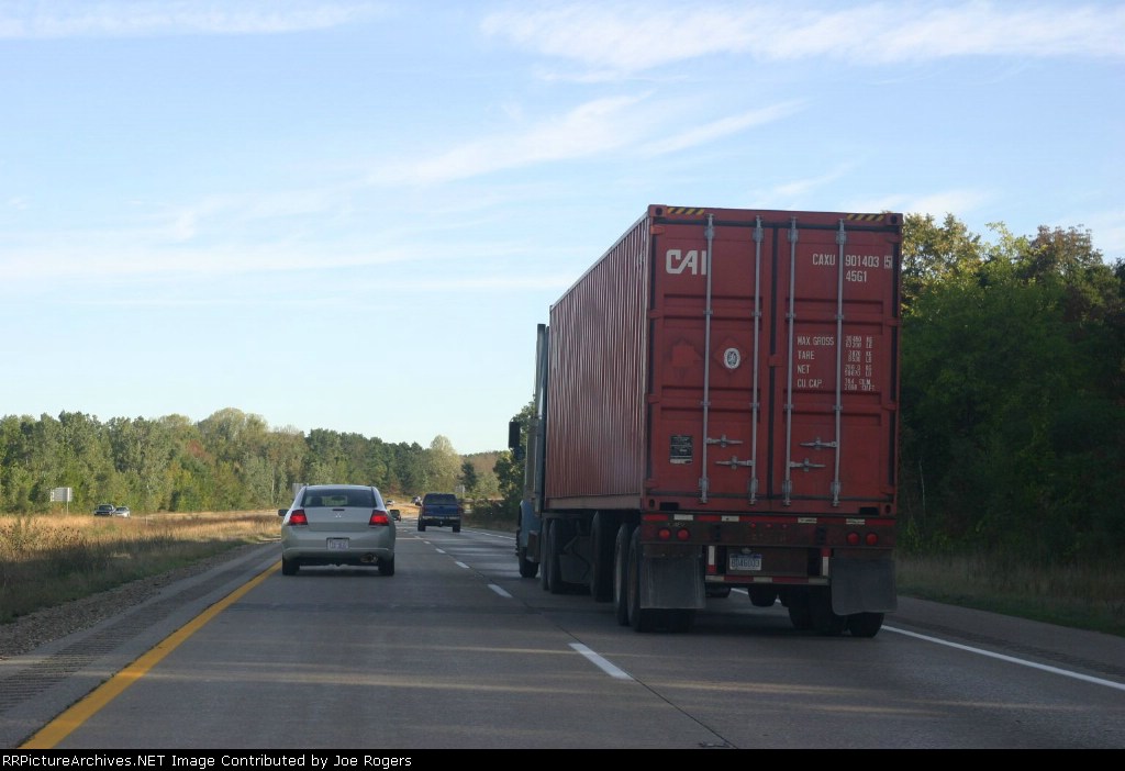 A rented car passes CAXU 901403 on I-196