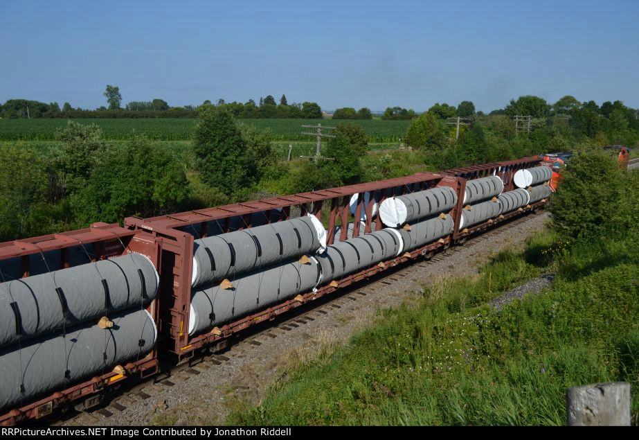 Centerbeam flatcars with Concrete pipe loads