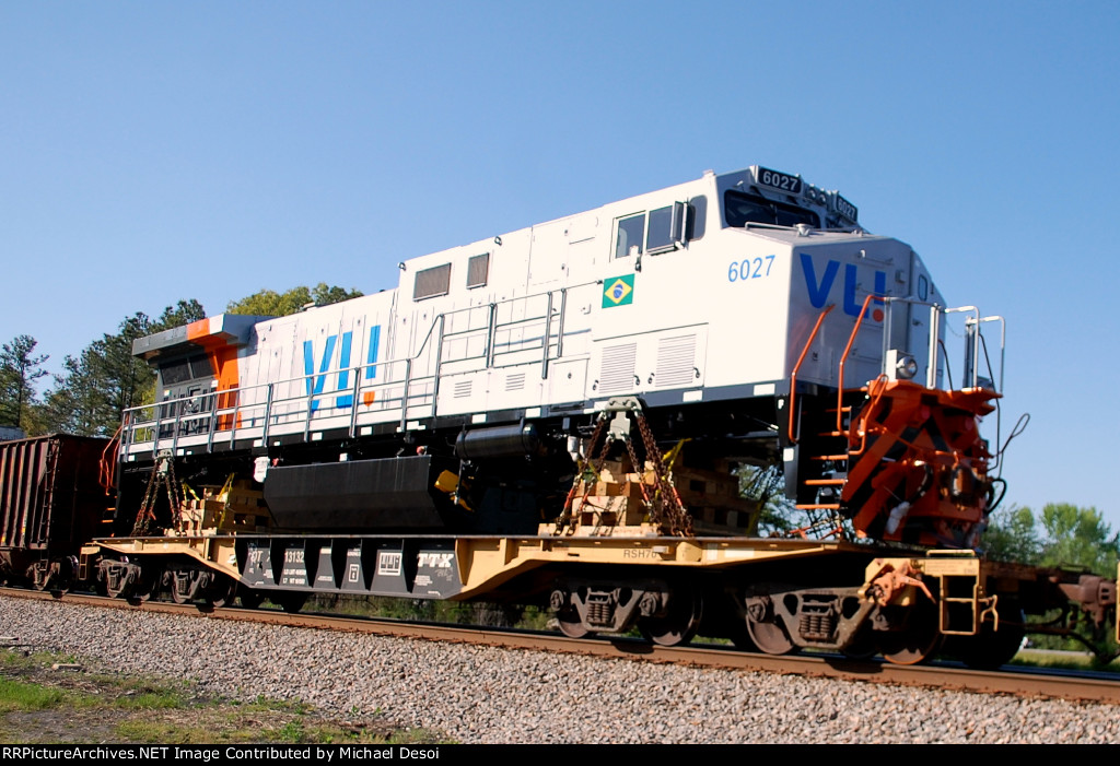 VLI BB40-9WM #6027 is one of 8 locomotives in this train heading east bound for the port of Norfolk VA, and then on to Brazil, seen here about to cross Rives Rd.
