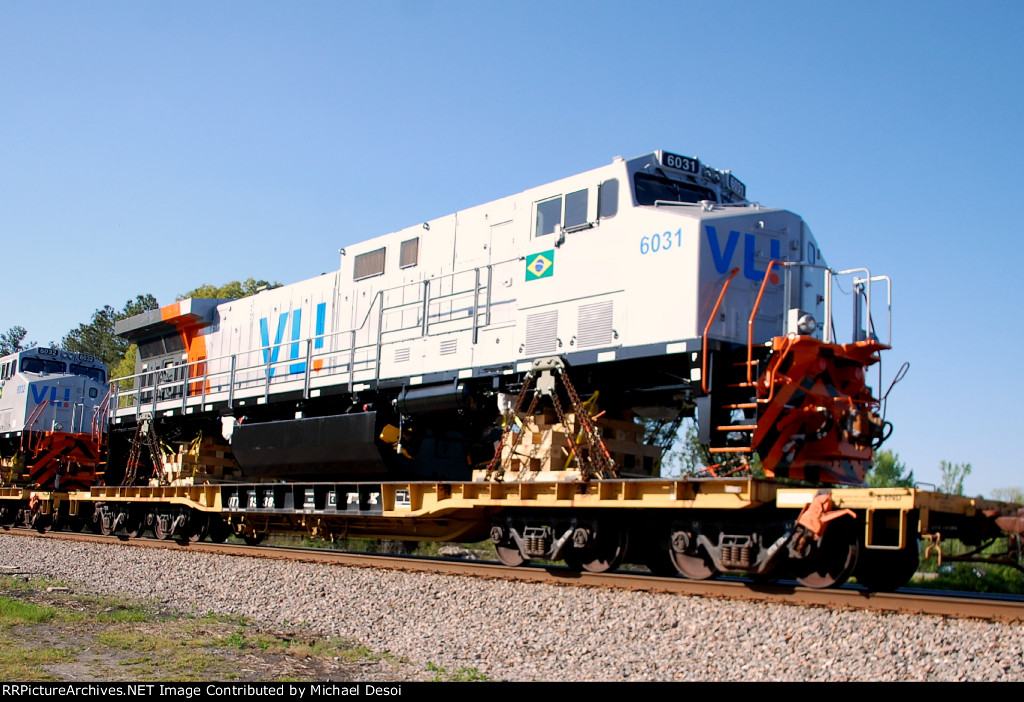 VLI BB40-9WM #6031 is one of 8 locomotives in this train heading east bound for the port of Norfolk VA, and then on to Brazil, seen here about to cross Rives Rd.