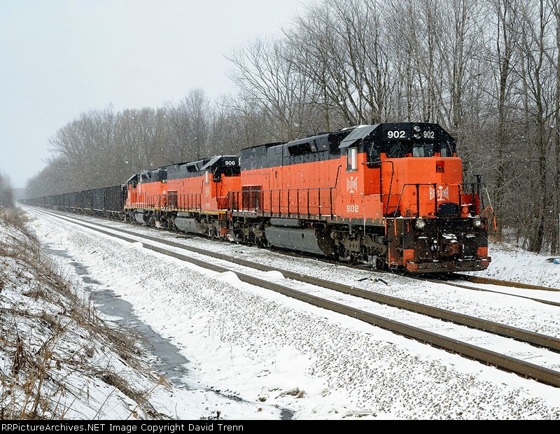 B&LE 902, 906 and 878 await a new crew as the snow flies through the air.