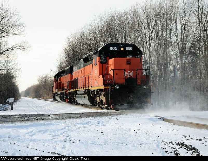 B&LE 867 & 905 pass by Huntley Rd kicking up a little snow 