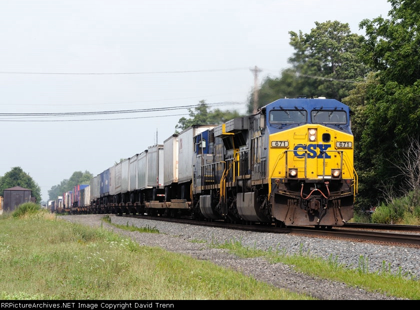 CSX 671 leads Westbound CSX Q117 at MP 102 on track number one.