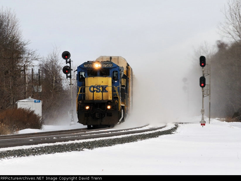 CSX 7569 kicks up the snow as it leads Westbound CSX ^227 at CP97 on track number one. 