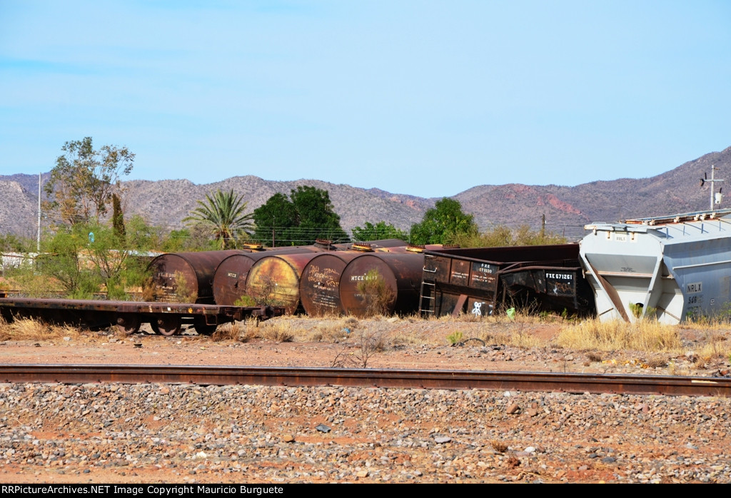MTCX tank cars and FXE hoppers in rail car cementery