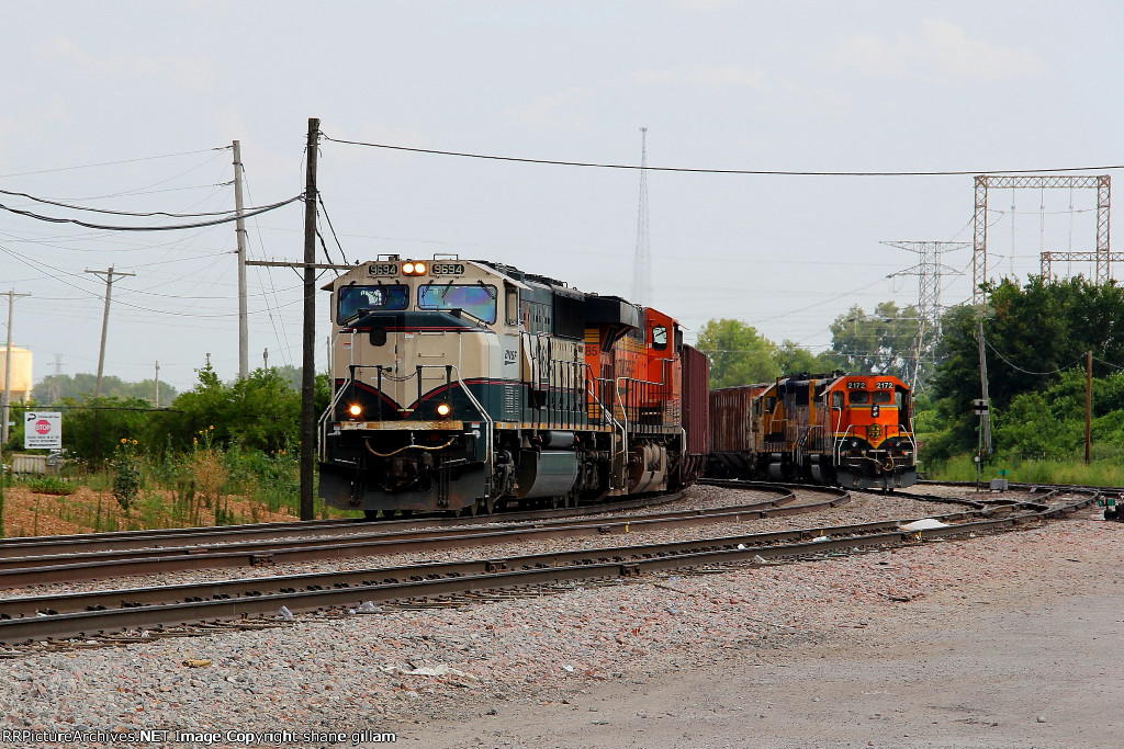 BNSF 9694 heads the NB ore train in north stl.
