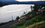 UP stack train heads east through Cascade Locks, OR at sunset