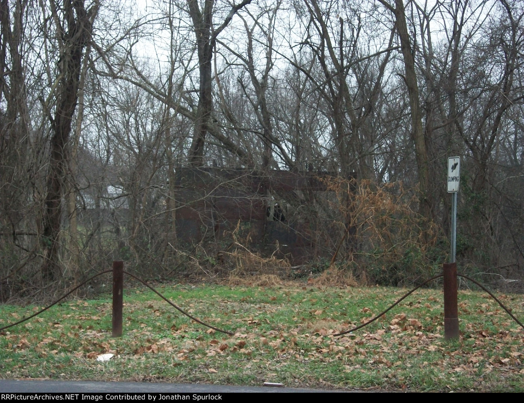 Wider-angle view of approach to former B&O plate girder bridge