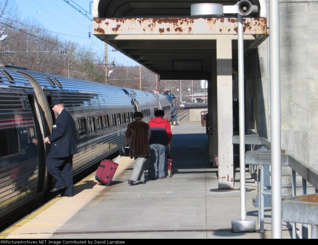 Train #88 at the Platfrom, Train #153 approaching from the north. 