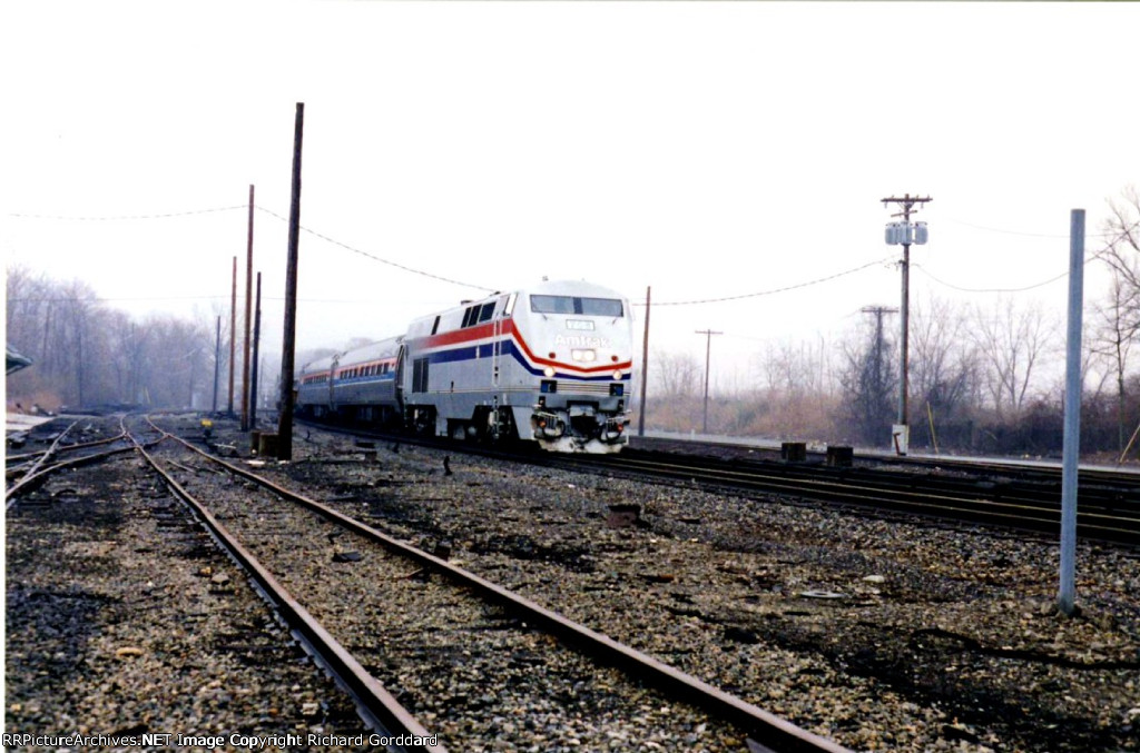 Cold Drizzle falls as a Northbound Amtrak Flys By.