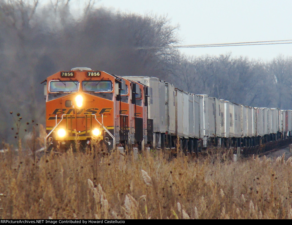 WB Z train doing every bit of 70mph through Coal City Ill with BN 7856 leading