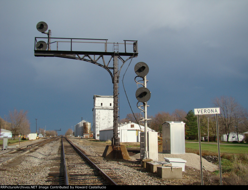 As the dark skies of the passing thunderstom, one last look at the EAS cantilever as these signals will be taken down in the spring. 