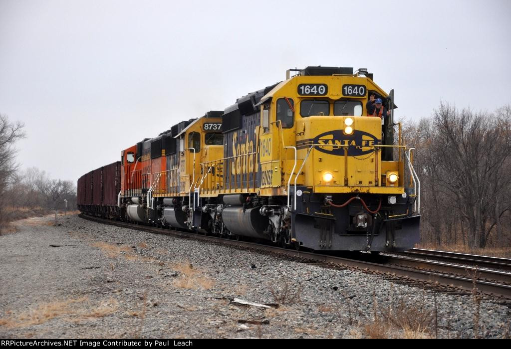 Eastbound ballast train with friendly conductor