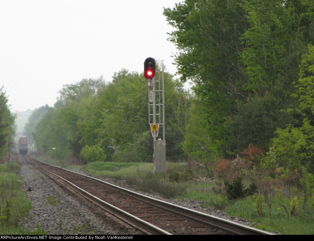 Signal is red as CP 9728 heads into the fog.