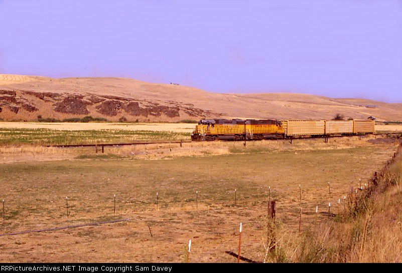 the whole train crossing through a field