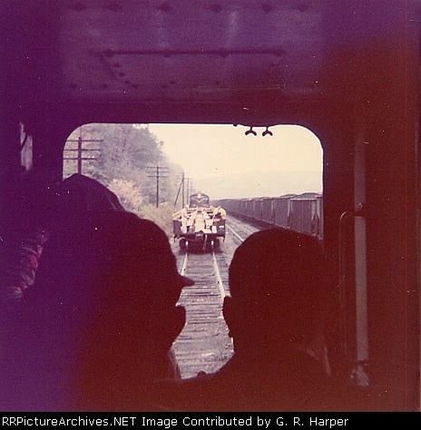 Yard engines shove the open-air gons to the special