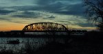 Louisville&Indiana goingover the 14th street bridge at sunset.