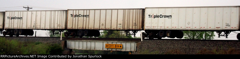 Three different lettering schemes on Road Railer/Triple Crown trailers
