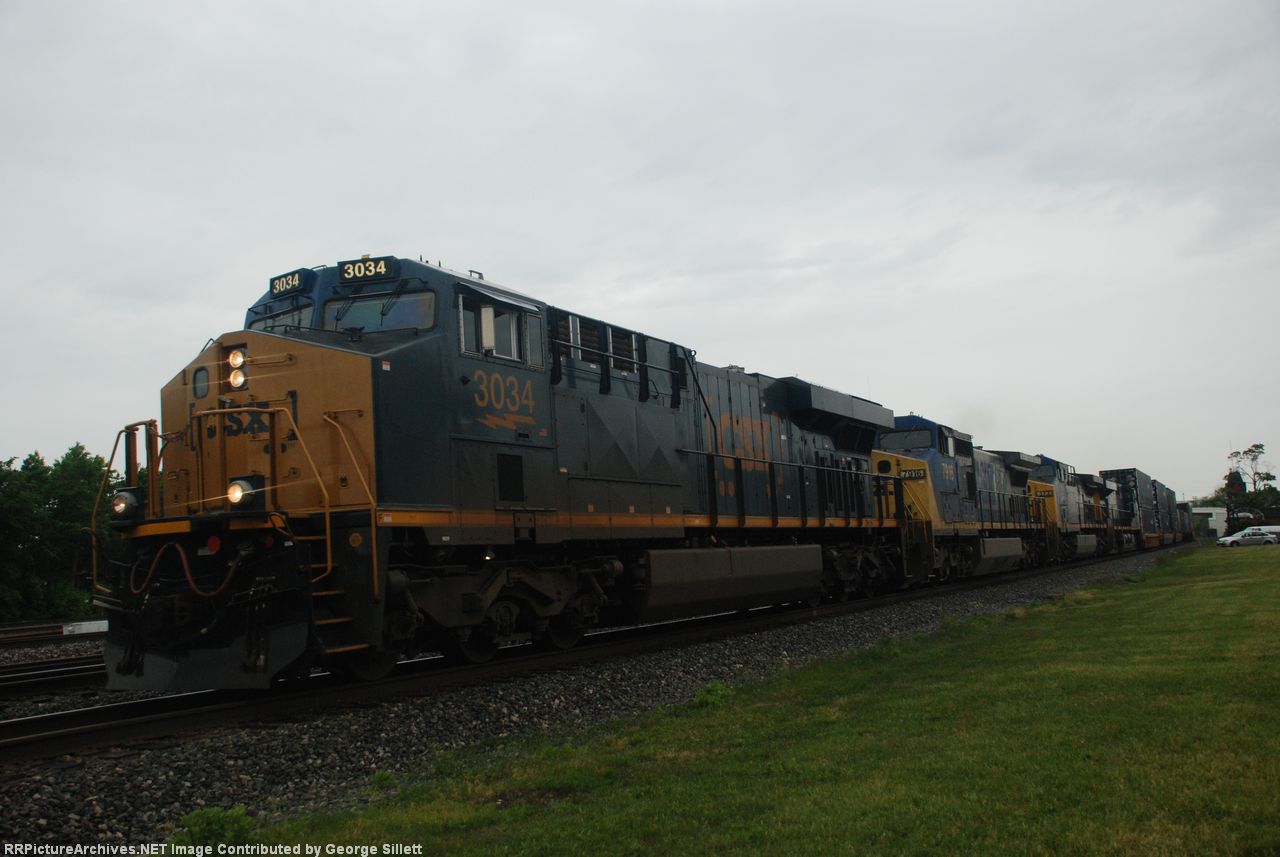 CSX 3034 speeds west with an intermodel in tow.