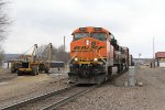 The M-SAVEOL pulls forward before starting its pick up as Hulcher crews prep their equipment