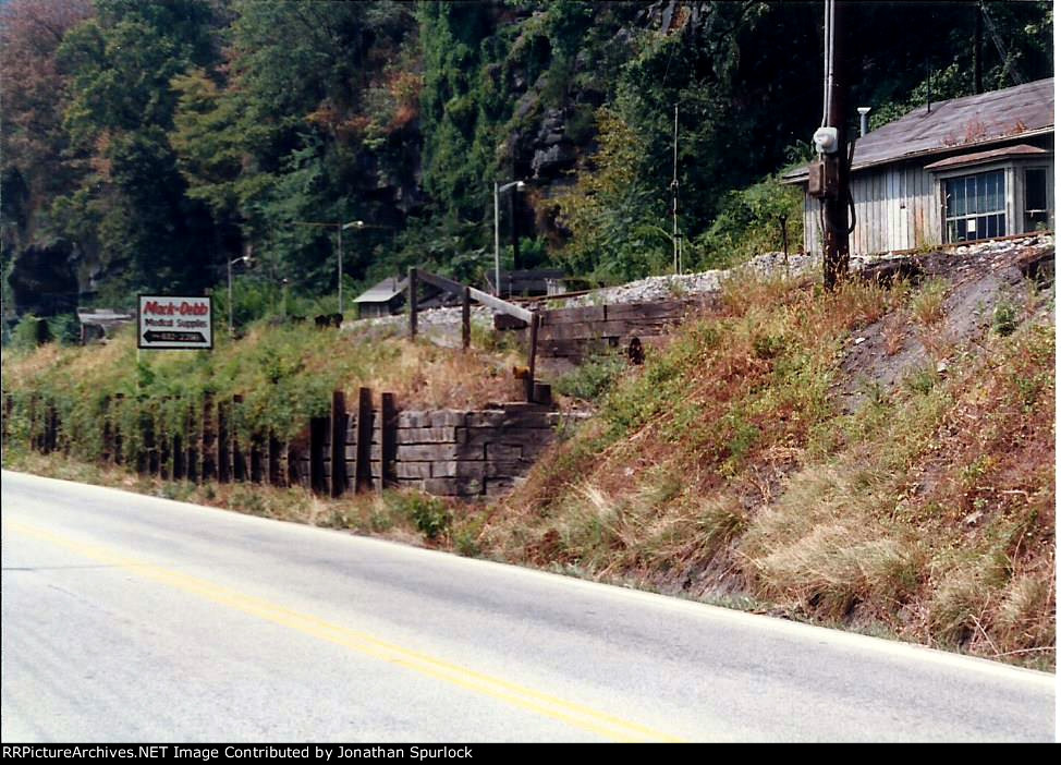 More crossties used for a retaining wall, looking west