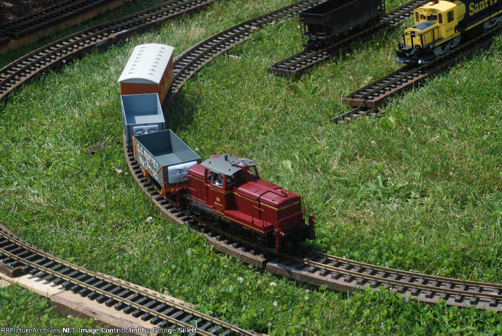 A G guage German engine hauls some Thomas cars.