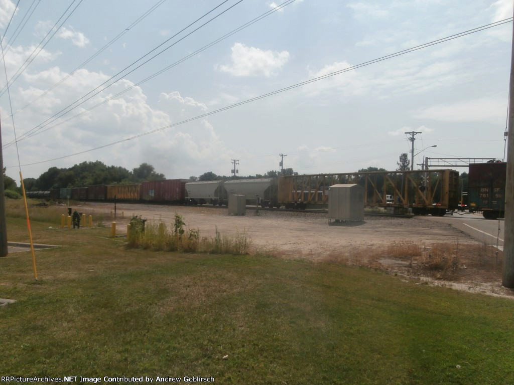 BNSF 761159 with other Cars behind