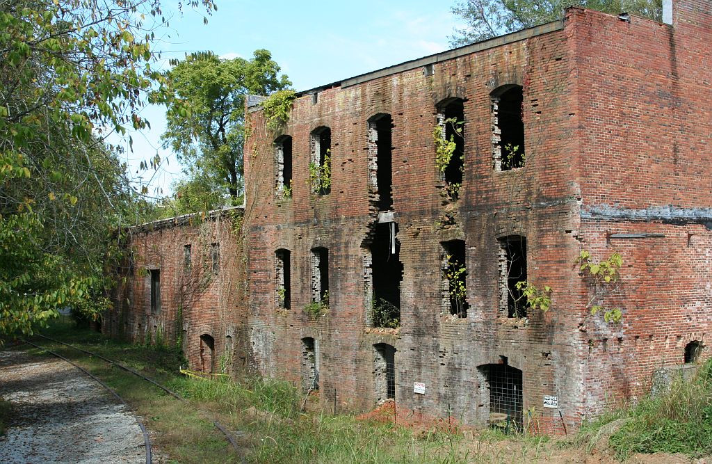 Mill in ruin by the track 