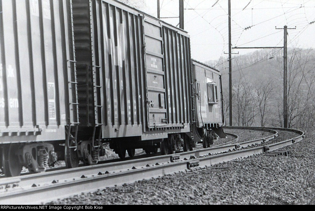 Conrail bay-window caboose on rear of westbound freight at Turkey Hill
