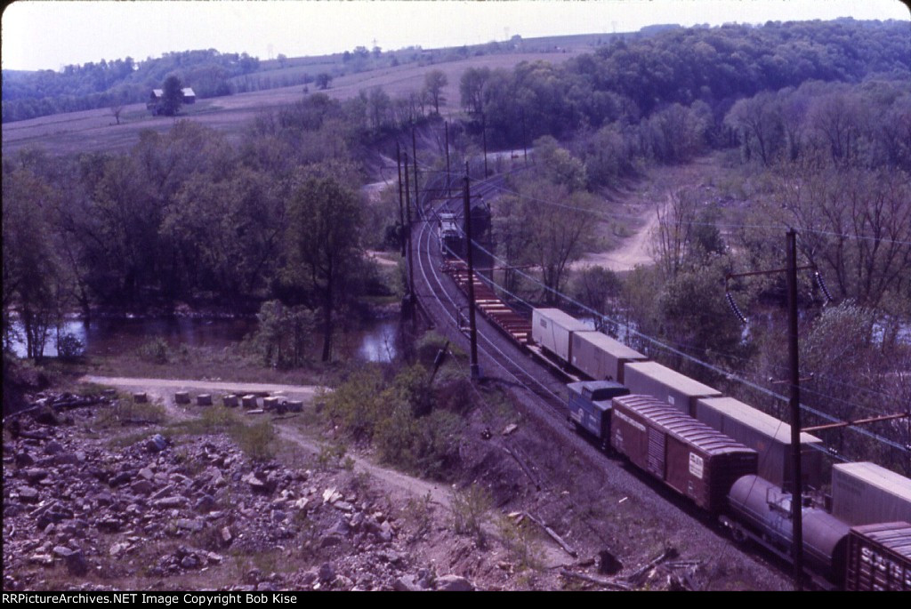 2 trains pass, crossing Codorus Creek