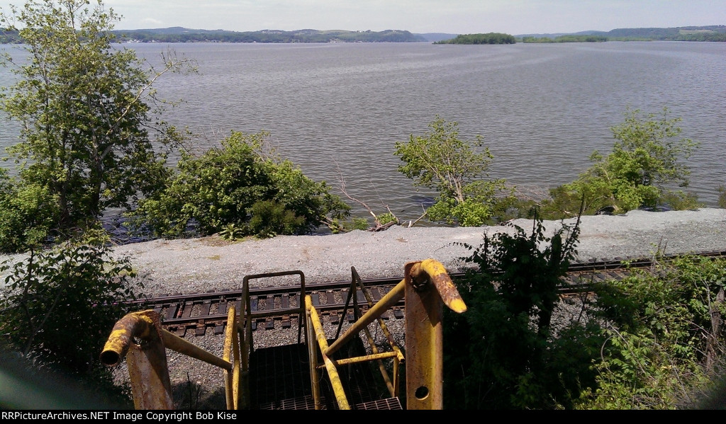 Looking down the steps to the Port Road, through the chain link fence