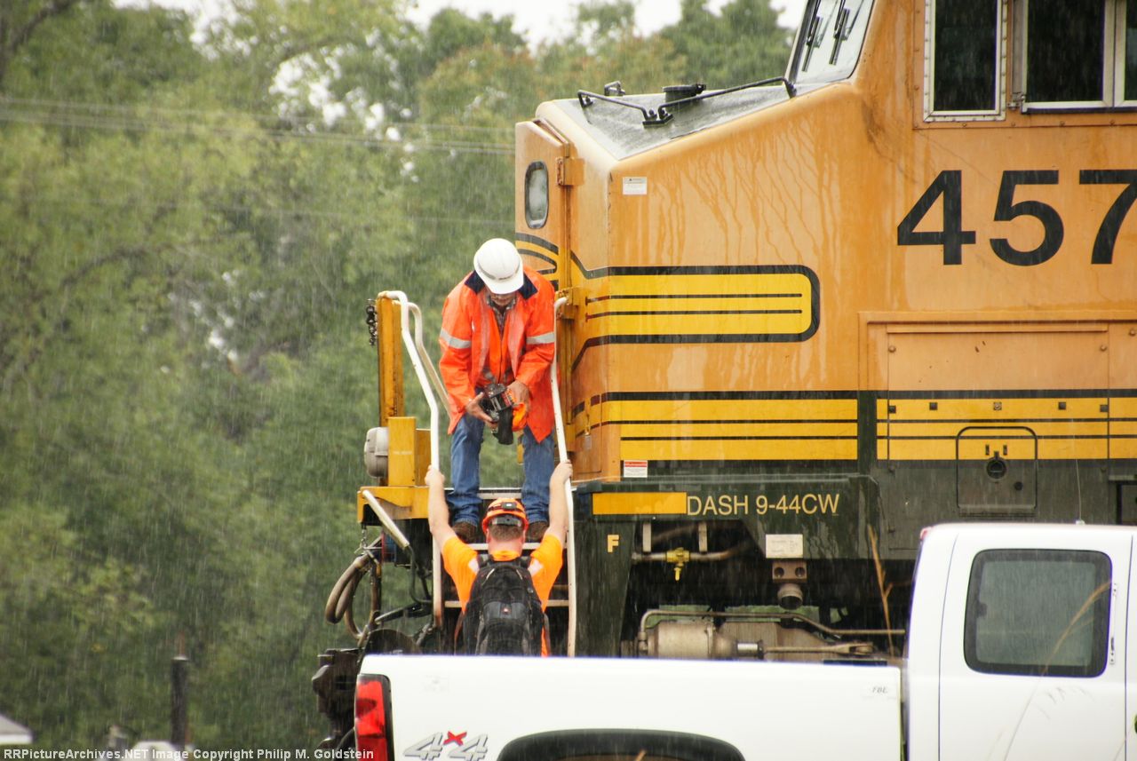 Handing up a electrical component for replacement.