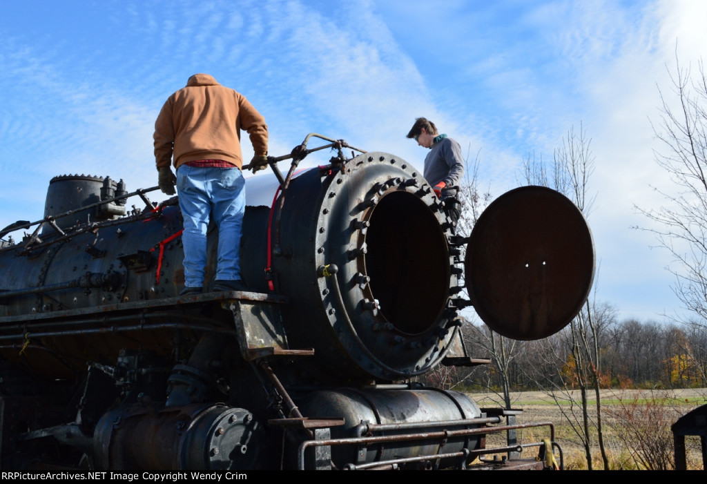 Attaching a cover for the hole where the smokestack was.