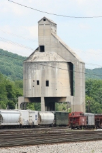 Massive coal tower slightly outweighing the caboose