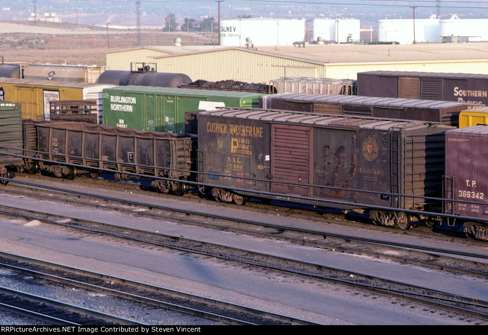 SAL 15400 & Golden State Metals Inc scrap metal gondola KNDX 9438 in the bowl tracks of the West Colton hump yard.