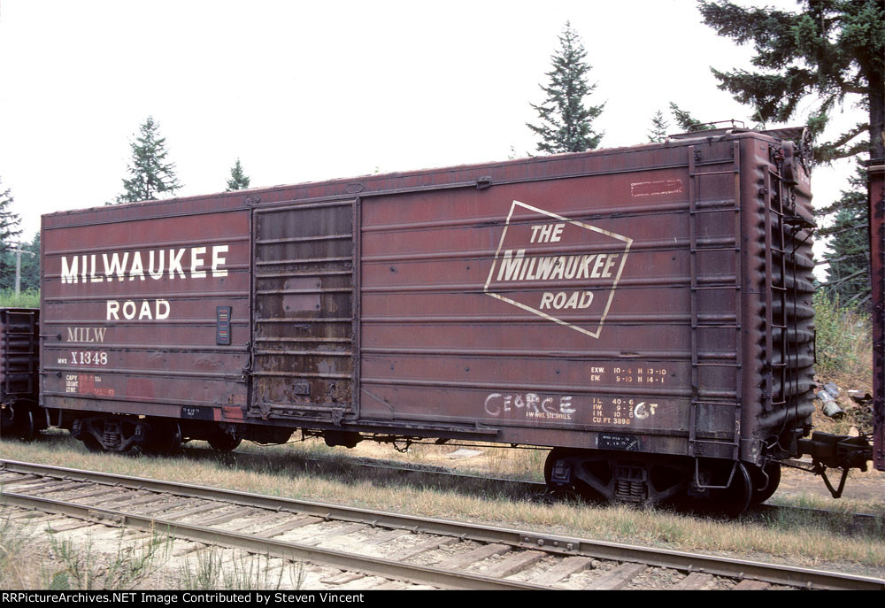 Milwaukee Road box X1348 in bridge gang train.