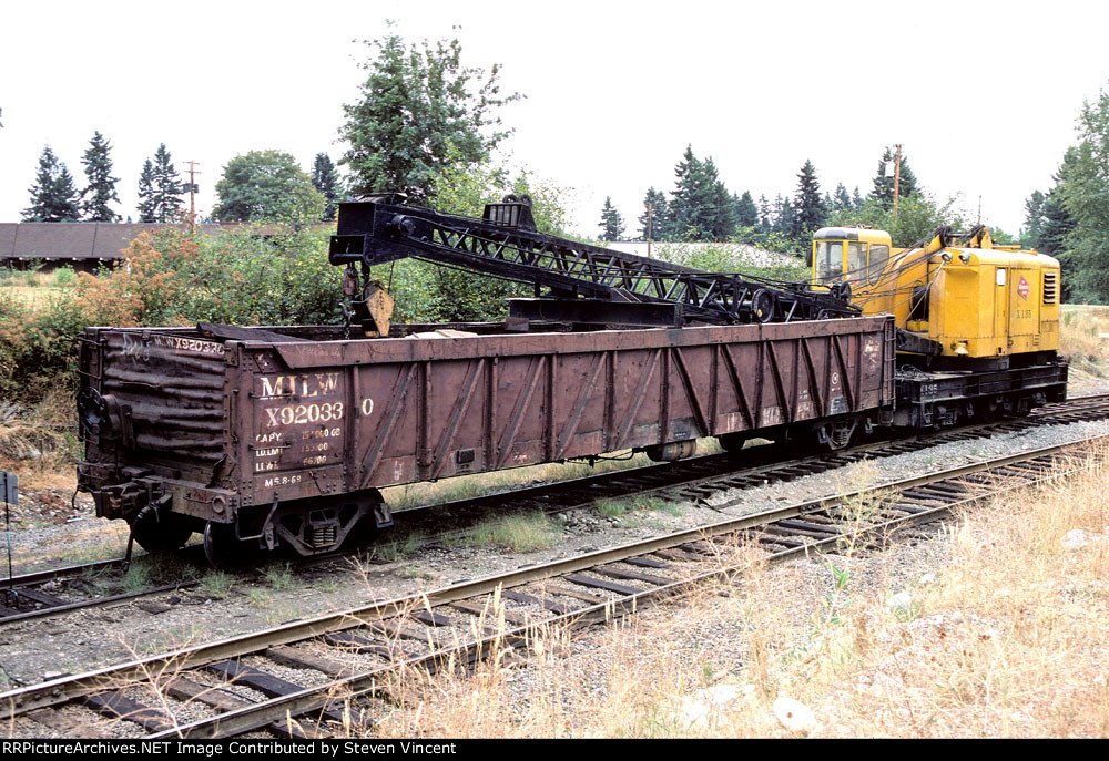 Milwaukee Road gondola X920330 boom car for diesel crane X135 on bridge gang.